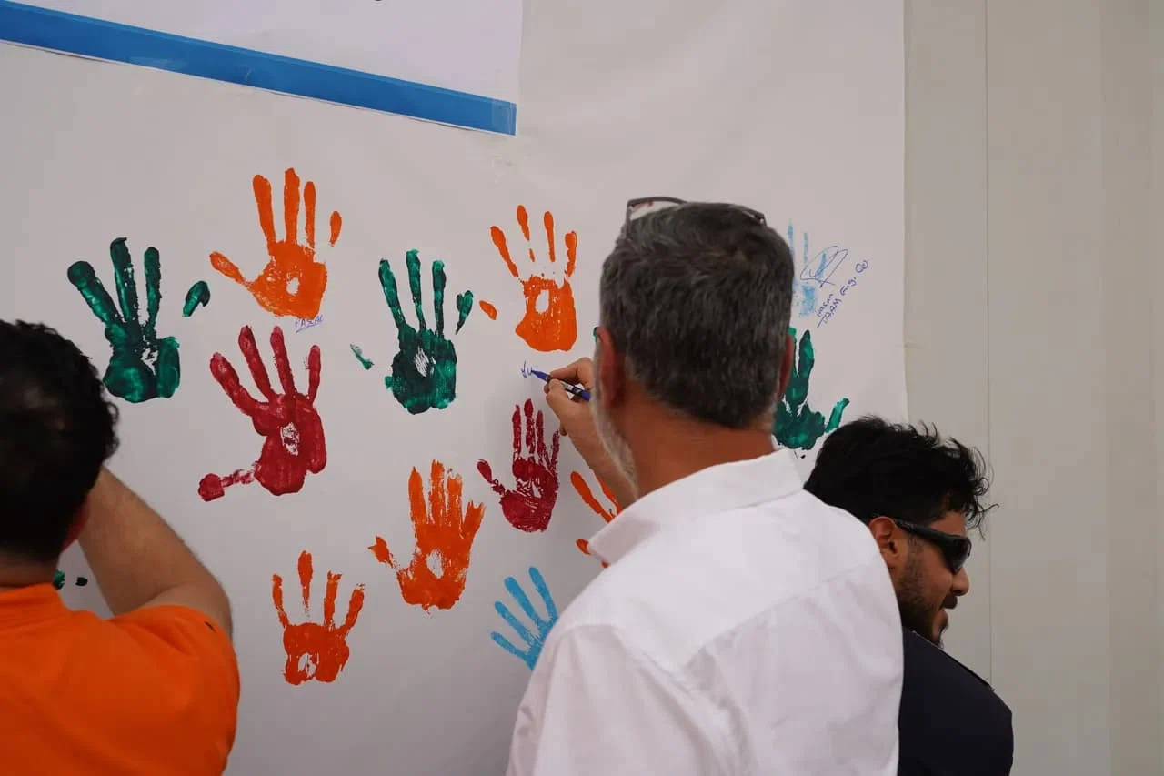 A participant contributing to a hand-safety awareness campaign
